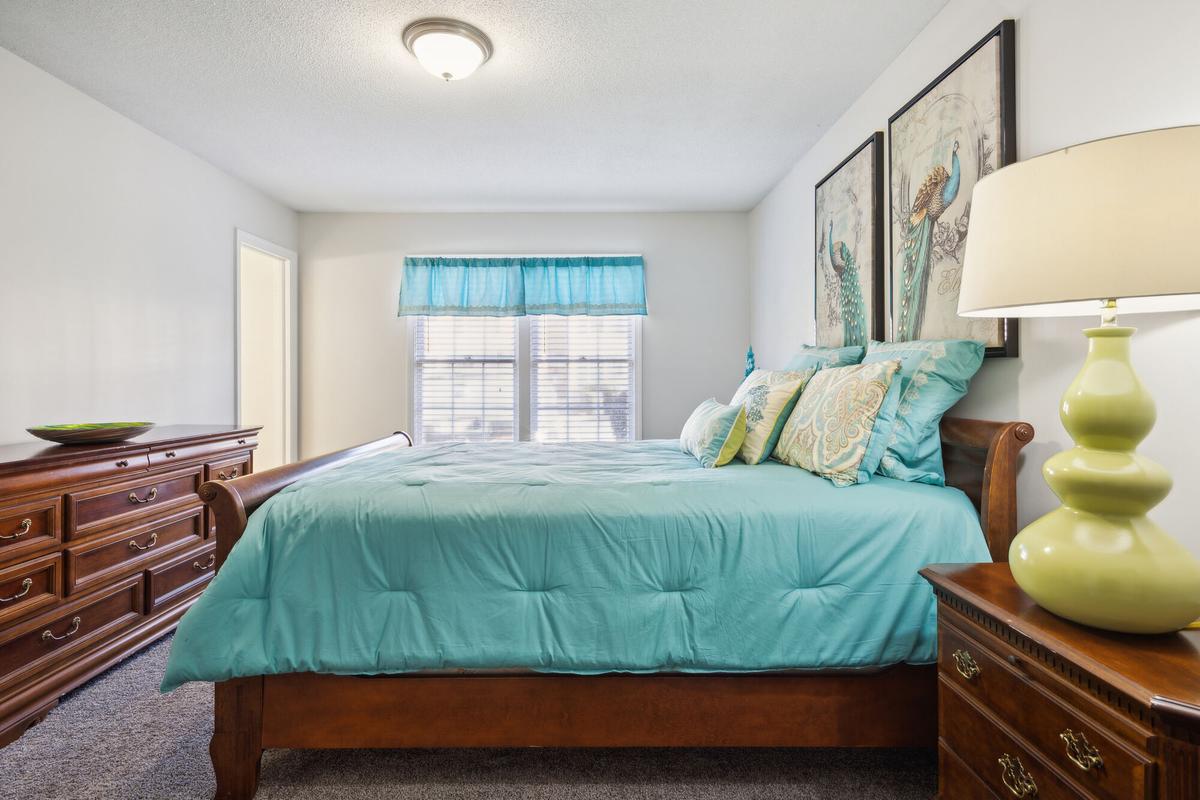 Bedroom in a Quail Run apartment home